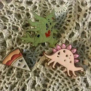 Novelty pin lot, including 1 Pokémon pin